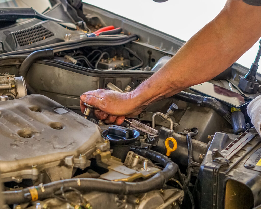 mechanic at work on an engine 2023 11 27 05 22 22 utc scaled