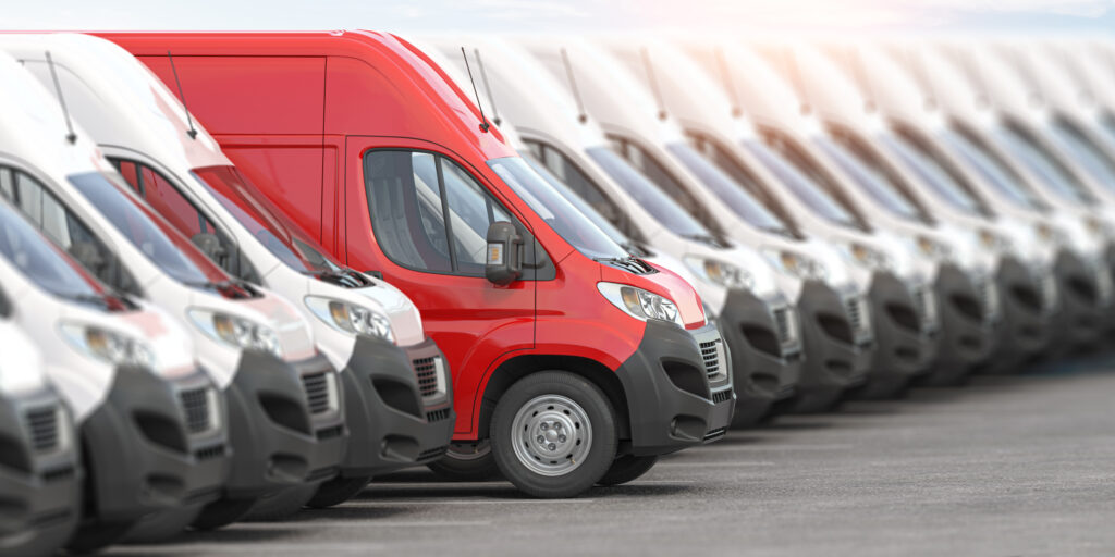 red delivery van in a row of white vans best expr 2023 11 27 05 01 22 utc scaled